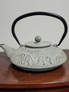 Vintage-style Light Sage Cast Iron Teapot with Embossed Elephants And Mountains